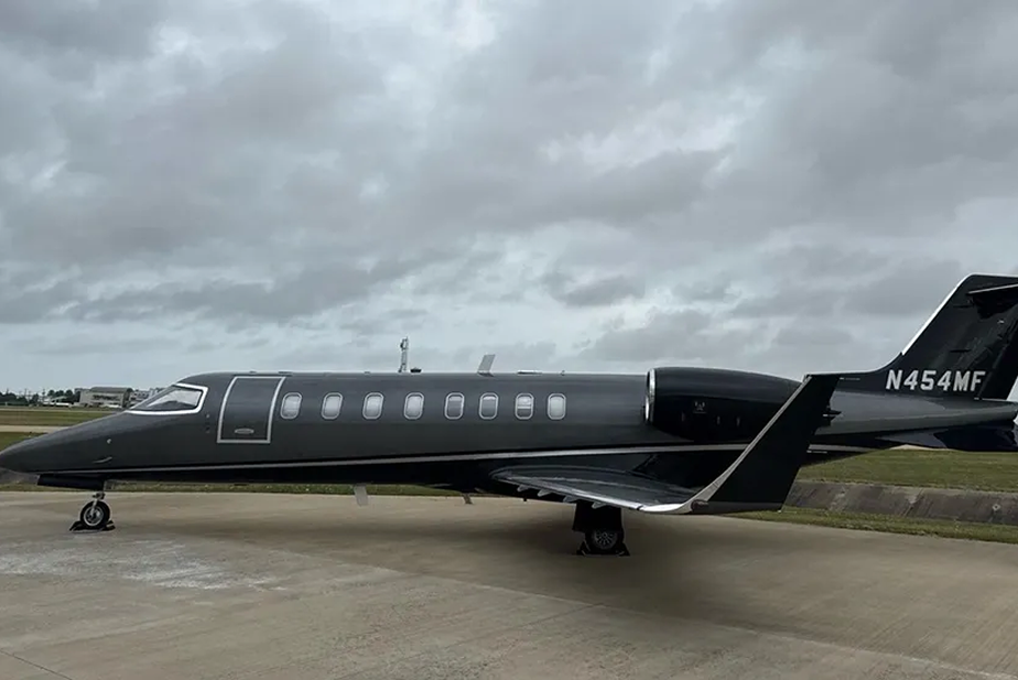 Port-side exterior view of black Learjet 45 N454MF