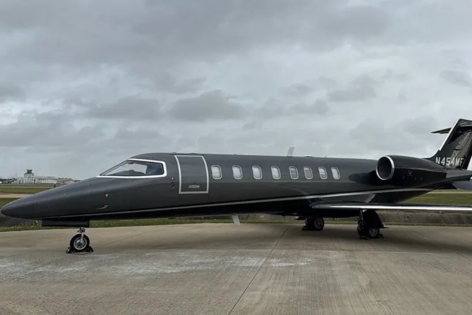 Forward port-side exterior view of black 2002 Learjet 45 N454MF