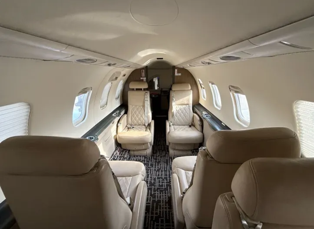 Aft-facing view of the light tan eight-passenger Learjet 45 cabin