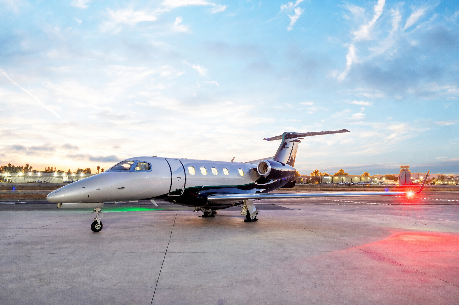 Business jet on an airport apron at dusk